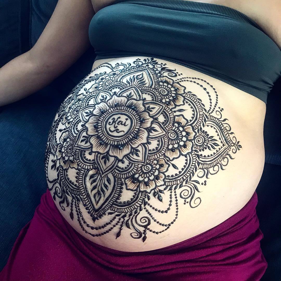 Premium Photo  Henna tattoo on a womans pregnant belly
