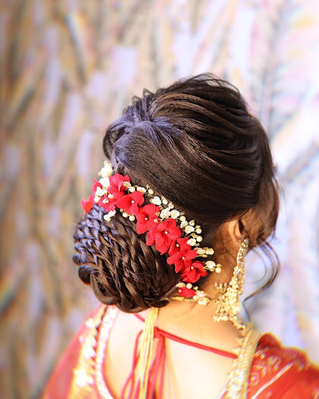 What a beautiful large low bun with real flower gajra Care however should  be taken be  Bridal hair buns Bridal hair decorations Bridal hairstyle  indian wedding