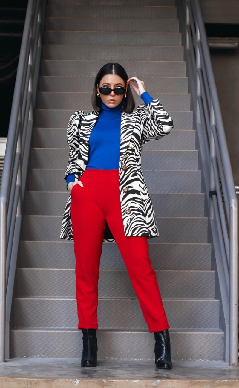 Andrea Nahle In a Zebra Print Jacket With Red  Pants
