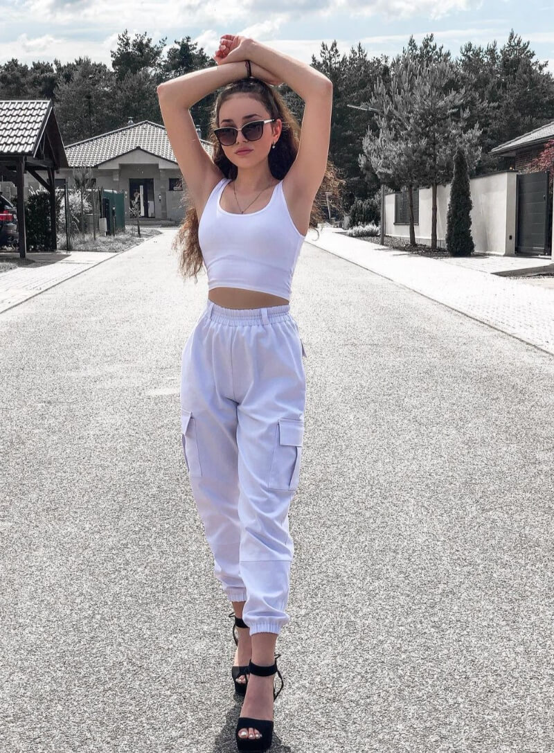 Kristal Shine In White Crop Top With Cargo Pants
