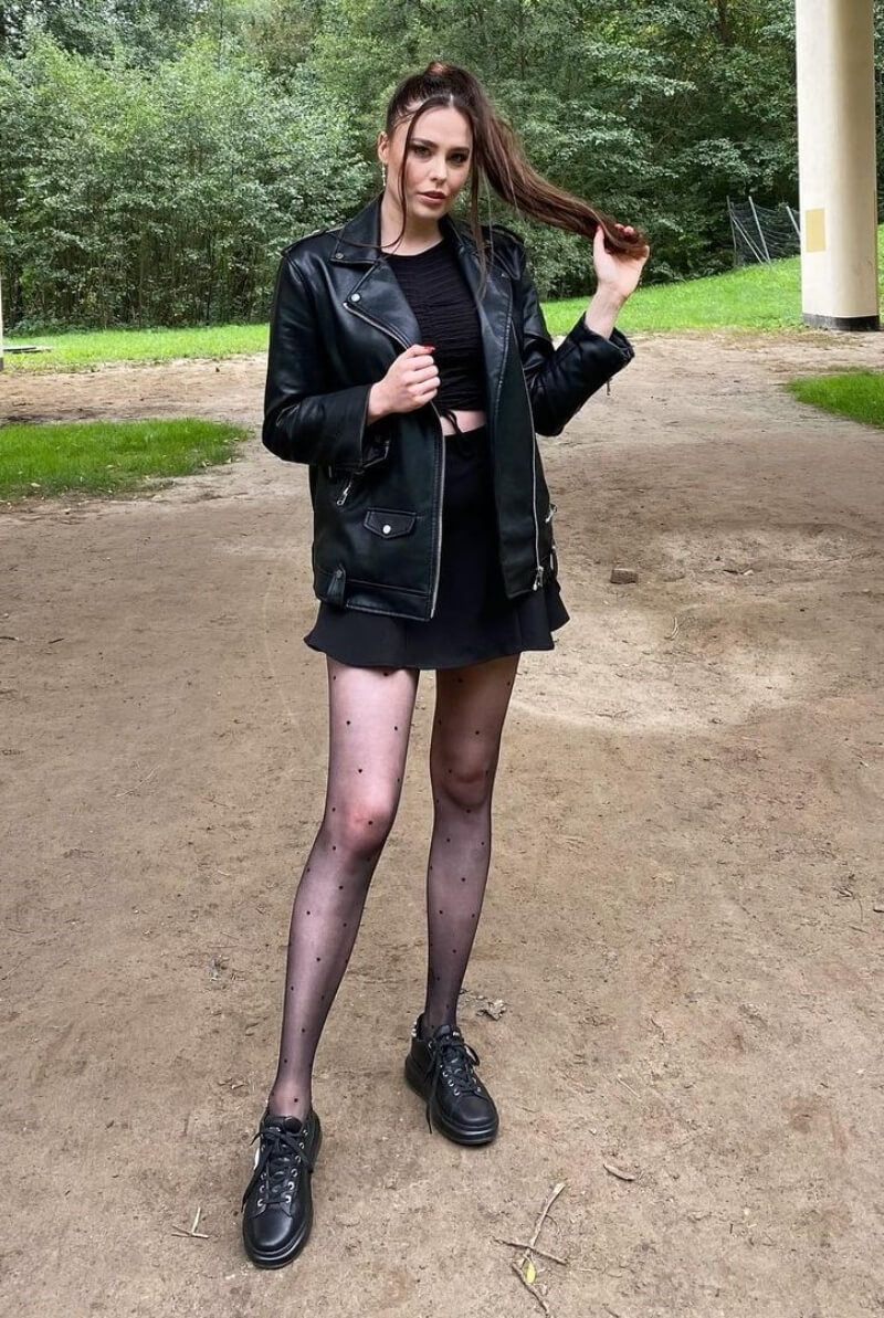 Karina Pochwała In Black Co-Ord Set With Leather Jacket