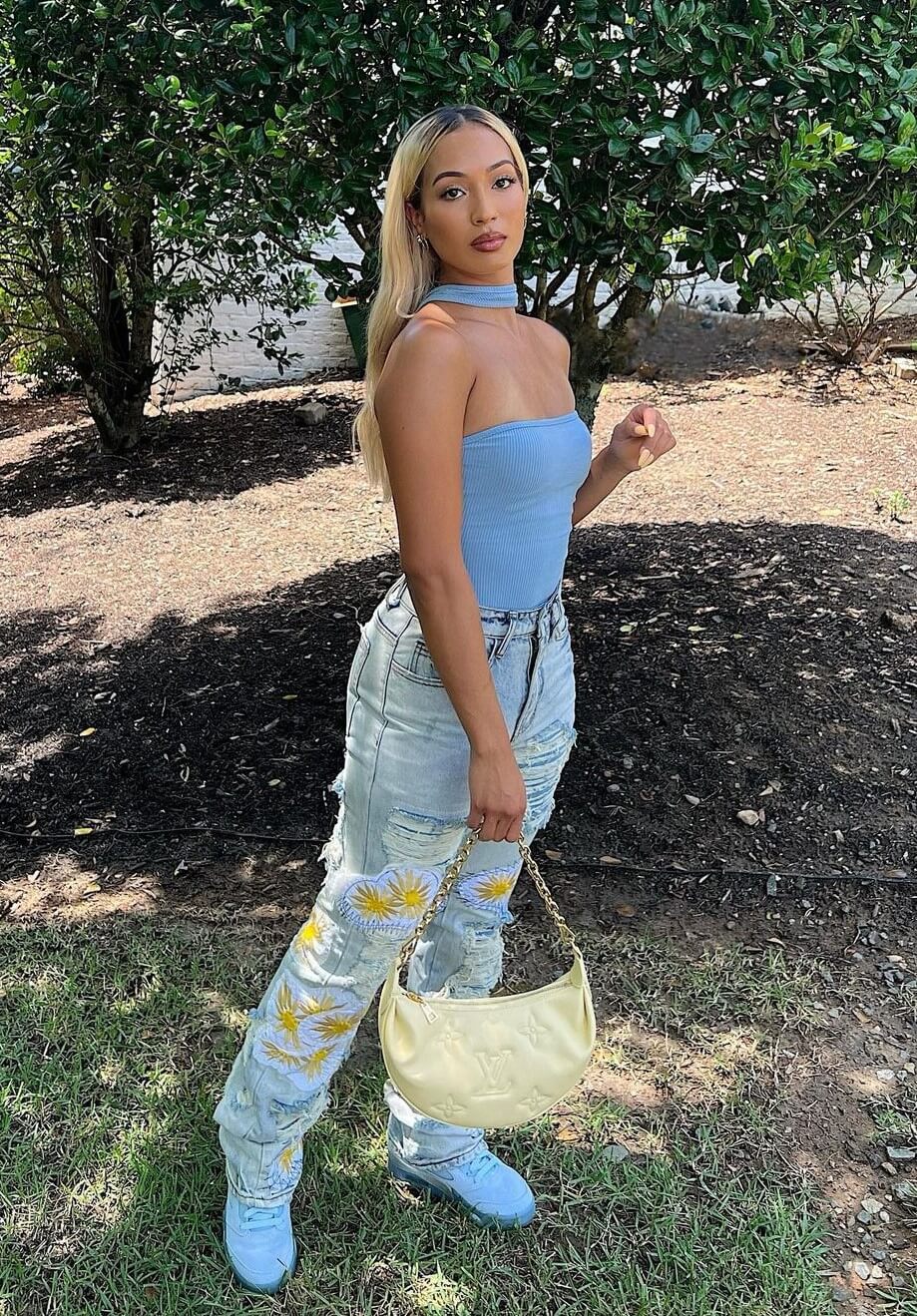 Marissa In a Blue Strapless Top With Ripped Jeans