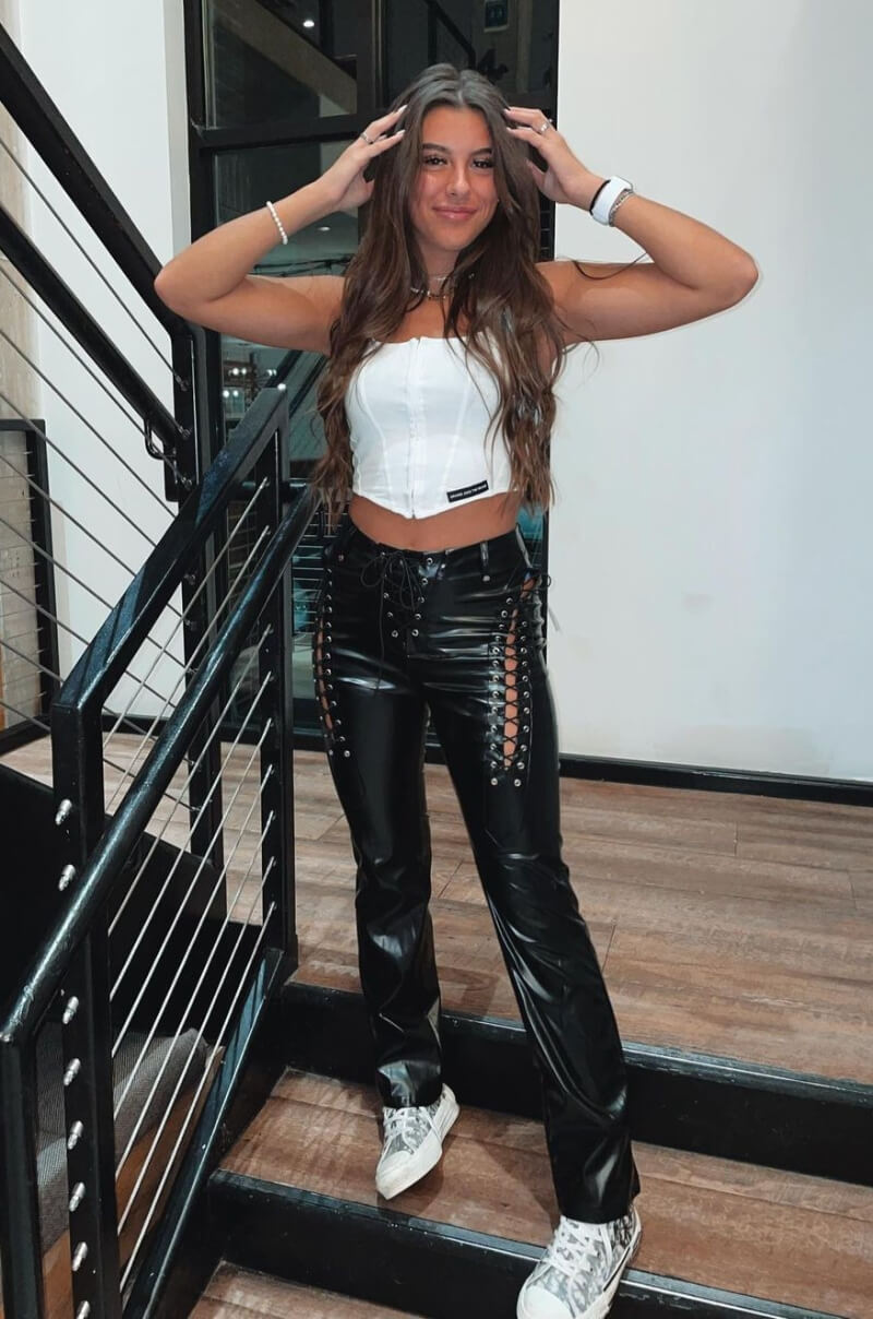 Olivia DeJarnett  In White Crop Top With Leather Pants