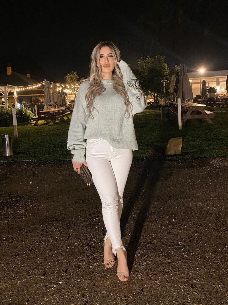 Tahmina Arsalan In a Woven Pullover With White Jeans