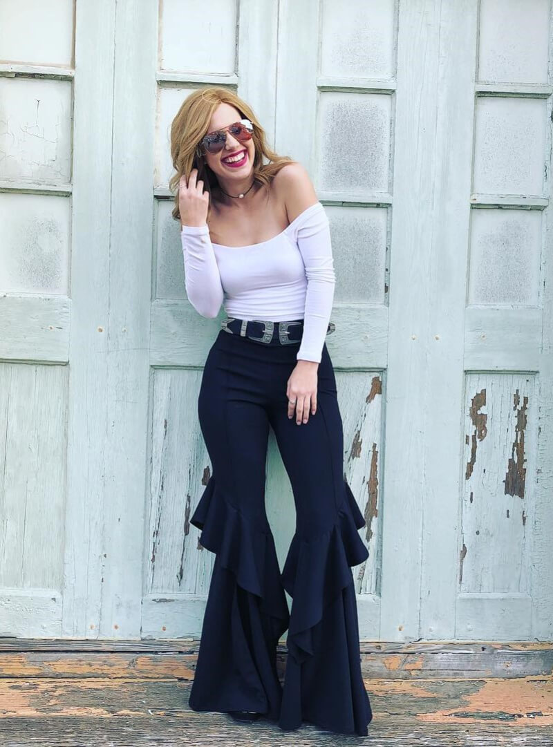 Taylor Poole In White Off Shoulder Top With Ruffle Pants