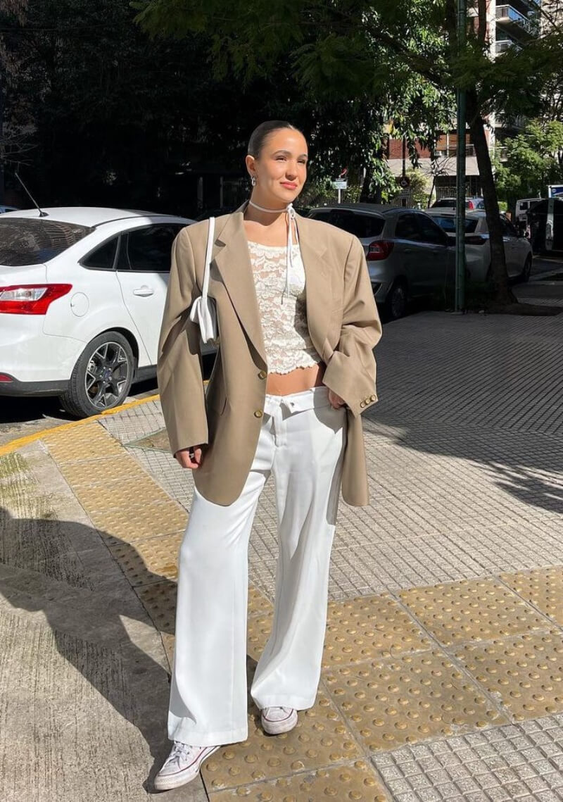 Tina Hirschson In a Long Blazer With White Pants