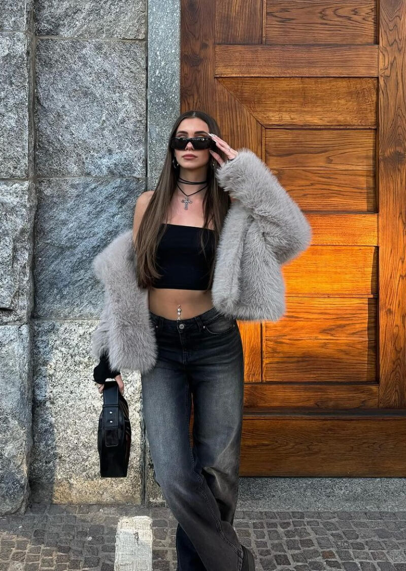 Alice Perego In Black Tube Top and Fur Jacket With Jeans