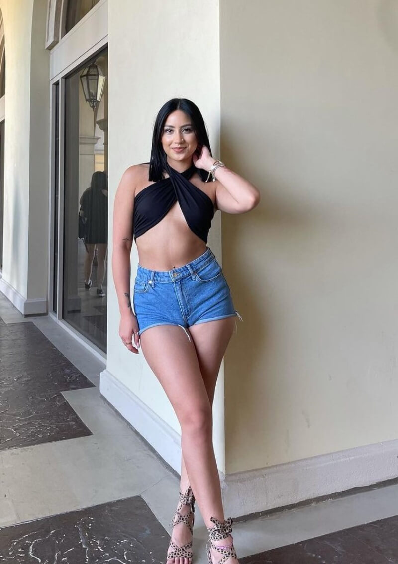 Brittney Bobay In Black Wrapped Top With Denim Shorts